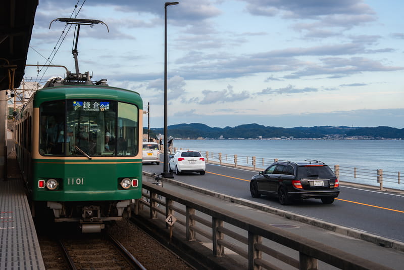 Enoden train along Sagami Bay in Kamakura Japan