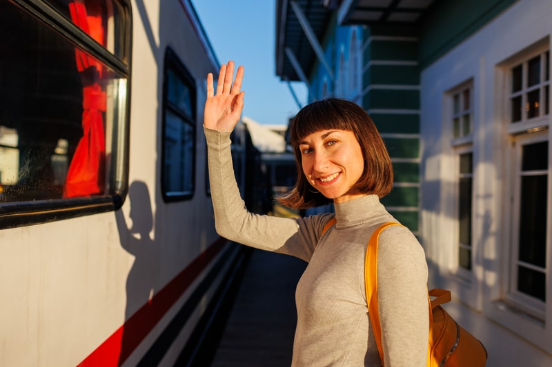 Person saying goodbye at train station in Japan